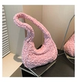 Detail view of pink ruched dumpling bag with bubble texture and secure zipper closure - Pink