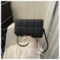 Black padded grid cross-body bag in soft PU leather with matching shoulder strap - Black