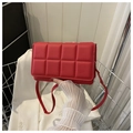 Vibrant red quilted crossbody bag with stylish magnetic flap and matching shoulder strap - Red