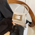 Mini white leather crossbody bag with oversized silver bow clasp and chain strap - White