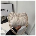 Chic beige quilted chain shoulder bag with stylish fold closure and gold metal logo - White
