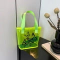 Neon green transparent PVC tote bag featuring a black butterfly print and nylon handles - Green