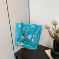 Blue semi-transparent tote bag with black butterfly prints and woven handles - Blue