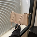 Chic beige baguette underarm bag with gold FASHION lettering and slim shoulder strap - Khaki