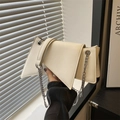 Chic off-white geometric chain shoulder bag with minimalist flap design for women - White