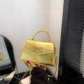 Mini goud metallic crossbody tas met decoratieve strik en handvat voor dames - Goud