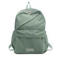 Minimalist bean green nylon backpack for students featuring unique diagonal zipper and fashion label - Green