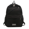 Minimalist all-black nylon backpack featuring a rectangular silver FASHION label on front - Black