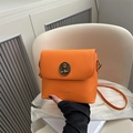 Chic vibrant orange crossbody bucket bag with vintage bear emblem and FANYISSA logo - Orange