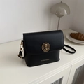 FANYISSA black leather shoulder bag with gold bear emblem and magnetic closure - Black