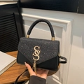 Elegant black crossbody bag with colorful glitter details and golden metal hardware - Black