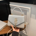 Light gray leather handbag with sparkling glitter flap and gold S logo with fringe tassel - Silver