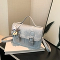 Silver grey textured mini square crossbody bag with metallic finish and top handle - With Pendant / Silver