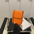 Vertical mini square crossbody bag in bright orange textured leather with chain strap - Orange