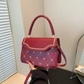 Red quilted handbag with gold heart sequins and wheat stitch trim on the flap - Red