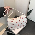 Chic cream corduroy crescent bag with red strawberry print and golden zipper detail - White