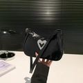 Chic black patent leather underarm bag with a silver rhinestone heart-shaped ornament - Black