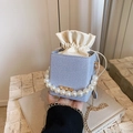 Mini denim drawstring bucket bag with pearl handle and golden chain strap in blue - Blue