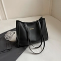 Large black leather tote bag with white contrast stitching and long shoulder straps - Black