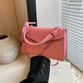 Elegant woven shoulder bag with knotted handle and pink textured flap design - Pink