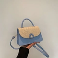 Sky blue crossbody bag with beige woven flap and decorative round buckle detail - Blue
