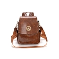 Retro brown oiled leather backpack for women featuring a gold swan emblem and wide strap - Tan