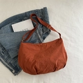 Caramel nylon half-moon crossbody bag with adjustable strap and casual aesthetic - Orange Without Pendant