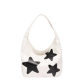 Borsa tote bianca minimalista con stelle nere e tracolla larga su sfondo neutro - Bianco