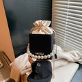 Vertical textured black bucket bag with pearl handle and chain strap for women - Black