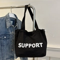 Borsa tote in nylon nero con scritta SUPPORT e coulisse laterale regolabile - Nero Con Lettere Bianche