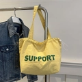 Borsa tote in nylon giallo con scritte support verdi e dettagli con coulisse bianca - Lettera Verde / Giallo
