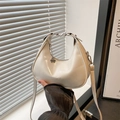 White crescent underarm bag with clover pendant and removable shoulder strap - White