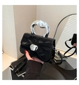 Close-up of black pleated texture bag with liquid silver handle and heart buckle - Black
