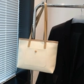 Minimalist cream tote bag with khaki straps and front pocket for daily commute - White