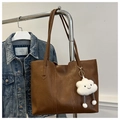 Detailed view of a brown faux leather tote bag with a cute white plush cloud charm - With Cloud Pendant / Dark Brown