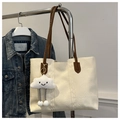 Detail of cream tote bag with coffee handles, plush cloud charm on a metal hanger - With Cloud Pendant / White
