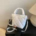 Chic white quilted bucket bag with padded handle and matching fabric shoulder strap - White