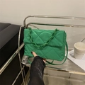 Bright green quilted crossbody bag with stylish chunky plastic chain strap and sleek finish - Green