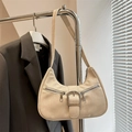 Minimalist cream hobo bag with decorative silver zippers and leather buckle strap - White