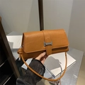 Brown crocodile pattern baguette bag with silver buckle and black handle contrast - Brown