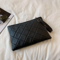 Classic black quilted clutch bag with matching wristlet strap and silver zip closure - Black