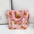 Pink canvas tote bag featuring cute capybara print and 3D plush doll accessory - Pink