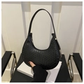 Detail of the intricate woven texture and silver zipper on the black crescent hobo bag - Black