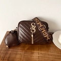 Dark brown quilted camera bag with wide logo strap and circular coin purse detail - Brown