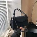 Minimalist black embossed floral square handbag with top handle and gold hardware detail - Black