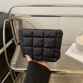 Minimalist black quilted cosmetic clutch with bubble texture and square stitching - Black