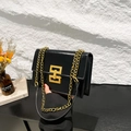 Glossy black leather square bag with gold chunky chain strap and geometric buckle - Black