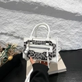 Mini crossbody bag in white leather and grey leopard print with tassels and metal buckle - White
