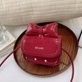 Red mini crossbody bag for girls featuring a large bow and white polka dot pattern - Red