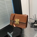 Caramel brown gloss leather crossbody bag with square metal lock and chain strap - Dark Brown